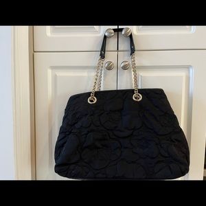 Kate Spade black floral quilted shoulder bag.